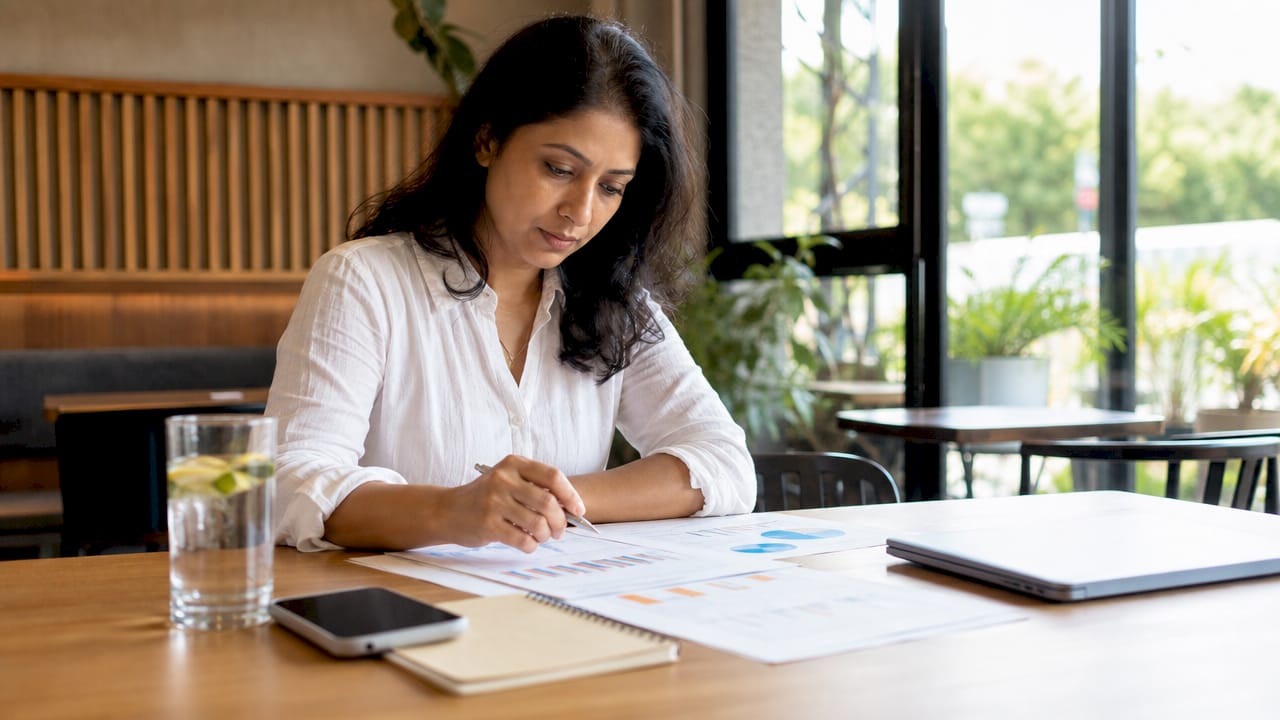 HR professional reviewing workforce data sheets